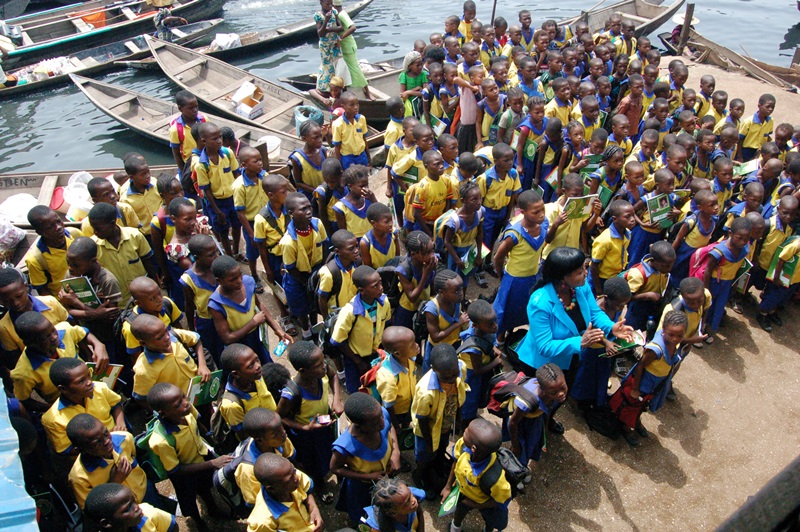 Betty Abah, CEE-HOPE's founder and 2006 fellow (in front) with pupils in a school in Makoko, a slum community in Lagos, Nigeria.